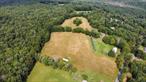 Imagine 17.20 acres of cleared land in a picturesque setting, perfect for building your dream home! This expansive property features gently rolling terrain, with a mix of open meadows and a backdrop of lush trees at the edges, providing both beauty and privacy. The land is bathed in sunlight, offering stunning panoramic views of the surrounding landscape. Call today and make this your dream home setting. Additional Information: SoilType:Clay,