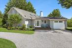 Welcome to this stunning custom contemporary home in the sought-after Remsenburg neighborhood, which is just minutes away from Westhampton Beach Village Main Street. This meticulously designed residence boasts a spacious and open floor plan with sleek lines and high-end finishes throughout. The primary suite, conveniently located on the main floor, is a luxurious retreat with its own ensuite, providing a serene and private sanctuary. Upstairs, you&rsquo;ll find two generously sized bedrooms, perfect for family or guests, offering ample closet space and natural light.  The heart of the home is the chef&rsquo;s kitchen, equipped with top-of-the-line appliances, custom cabinetry, and a large peninsula that is perfect for both meal prep and entertaining. The living area features a beautiful wood-burning fireplace, creating a warm and inviting atmosphere for relaxing evenings with family or friends. Adjacent to the living space, a large mahogany deck extends your living area outdoors, offering a perfect spot for dining or lounging by the in-ground pool. Beyond the pool is plenty of land providing ample space to create your private summer oasis.  Additional highlights of the property include a spacious garage and a part unfinished basement that offers endless possibilities for storage or customization. Whether you&rsquo;re seeking a peaceful retreat or a home designed for entertaining, this Remsenburg beauty has it all, blending luxury, convenience, and timeless style into one perfect package.
