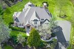 This magnificent colonial is nestled in a serene cul-de-sac with meticulously landscaped property which boarders state park land. The backyard is a true oasis with almost 2 acres of picturesque park like property that promotes privacy and tranquility. As you ascend up the drive you are met with how special this home is. This beautiful home is a thoughtfully designed 4/5-bedroom retreat that combines luxury, comfort, functionality, and entertainment seamlessly. Once inside, you are met with a cathedral foyer that boasts a stunning alabaster chandelier. The main floor is lovely with French doors, 2 wood burning fireplaces, and hardwood floors throughout. The Great Room is an outstanding entertainment space, with 9 ft. ceilings, a custom built-in entertainment center & wet bar. The Formal Living Room w/wood burning fireplace flows into the Dining Room with French doors to the backyard portico perfect for entertaining. The chefâ€™s kitchen features custom cabinets, granite countertops, double Thermador electric ovens, 6-burner Thermador gas cooktop and hood that allows you to entertain with ease. The kitchen, where loved ones gather flows into the family room with vaulted 16ft ceilings, fireplace and access to an oversized new trex deck that seamlessly connects indoor and outdoor spaces. The office with custom cabinets is a classic, which could also serve as a first floor bedroom. The spacious and luxurious primary bedroom is perfection with 12 ft. vaulted ceilings, a gas fireplace, balcony that faces the waterfalls outside, an en-suite with large tub, steam shower, double vanities & 3 walk-in closets. The second bedroom has 12 ft. ceiling and hardwood floors w/dedicated full bath. The third and forth bedroom share a spacious full bath with Jack & Jill doors, double sinks and water closet. The finished lower level has endless possibilities w/ 2 spacious versatile rooms ready to be designated(media room, gym, or potential en suite â€¦), wine room, full bathroom, storage room & access to a 3 car pristine garage. This home is very energy efficient with 5 zones for heat and 2 zones for central AC. Other features: security system. sprinkler system & indoor/outdoor sound system. With entertainment spaces throughout the home & the vast backyard offers amazing space for family gatherings, large special events or simply unwinding and enjoying your own private sanctuary. Only 50 minutes to NYC; minutes to Bear Mountain State Park; close to marinas, golfing, hiking trails, and 7 lakes. Enjoy fishing, kayaking, hiking, and boating or jet skiing on the Hudson River. LOW TAXES! This home is a must see. A true gem!