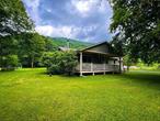 Located on the banks of the famed Beaverkill River, in the charming hamlet of Cooks Falls, this single story ranch home is quality through and through. Three bedrooms and two and a half baths with an open living, dining and kitchen area that is absolutely perfect for entertaining friends and family. The interior has heated floors, woodburning fireplace, en suite bathrooms for every bedroom, an attached heated garage and so much more. The exterior boasts hardyboard siding, vegetable and flower gardens, a large back deck and a front porch made for siting. Overlooking your own private riverfront on the Beaverkill River it is just pure bliss. Low taxes, minimal maintenance and no major projects hanging over your head here. This is a house that you can move right in and start making memories inside and out. From start to finish, this place is really ideal on many levels. Work from home or commute, with high speed internet and easy access to route 17 you just can&rsquo;t beat it. A short trip into town for your shopping and right around the corner from the Red Rose Motel and Tavern for a great burger and cold pint too. Schedule your tour today to find out why you&rsquo;ll want to make Cooks Falls your home. Additional Information: ParkingFeatures:2 Car Attached,