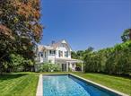 Historic Shelter Island Heights Home with Pool and Cottage. This beautifully renovated 1890&rsquo;s Victorian home is located in the heart of the Heights Historic District. Ideally located right off the North Ferry, and within a block of the private beach club and tennis courts. And just a stones throw to the Yacht Club. Beautiful architectural details remain throughout the exterior and interior of this Classic Historic home. The main house features 4 Bedrooms with 3 of them having their own balcony thru beautiful arched doorways. The primary bedroom is spacious with a full bath. Gorgeous wide plank pine floors are featured in every room. First floor includes a cozy parlor with fireplace, large den, custom eat-in-kitchen with high-end appliances and easy access to dining area and large wrap around porch for outdoor entertaining. Back deck overlooks the beautiful gardens and heated gunite salt water pool. Beyond the pool is an adorable 2-bedroom guest cottage. Adjacent to the cottage is a detached garage for car, storage, or game room. This home is a Gem. Rare find!