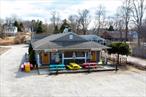 25 West Neck has three buildings on the property; Building one has two tenants and is 48 x 34.2. basement, there are two furnaces with two 275-gallon tanks. There is Ample Parking on the property. Building two is one tenant-occupied and is 24.3 x 33.5. Building 3 Griffin is 34 x 32 with a 10-ft overhead door. The building has large signage out front. There are water wells for all buildings; attached are plans to show the layout of the spaces. Two tenants occupy the front building. Tenant one is a bagel company occupying 1, 655 sq. Ft. Board health approval, front entry with porch and 7ft overhang. New 2018 air conditioner/heat, Exhaust added 2020, fire suppression system, walk-in refrigerator, grease trap 2024, fenced-in dumpster area, and much more. The second tenant is a dog groomer occupying approximately 1600 sqâ€”ft. Renovated in 2005, it includes a water filter, grooming area, laundry room, and retail section. The middle building was occupied for years by a dentist. In the 2021 handicap ramp, a hair studio with a 24x33.5 full basement, balcony doors, and a redone interior was constructed. The third building is a butlerâ€™s with a drive-thru door, open space, electric door, pad dumpster, six-inch concrete floor, and 100 amp. The owner had used it for storage. There are currently two leases for two of the four spaces.