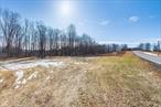 Cleared, leveled, vacant land. Approximately 1 ace approved for single family dwelling. Drilled well can be shared with adjoining property MLS ID 832899. Both parcels available as combined sale or sold separately.