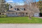 Located in the Pine Neck Landing community, 18 Landing Lane offers comfort, privacy, and access to waterfront amenities. This 4 bed, 3 bath Colonial features spacious interiors and a landscaped backyard with an inground pool. The heart of the home is the chef&rsquo;s kitchen, complete with a six-burner range with grill top, two sinks, two dishwashers, an oversized refrigerator, and a breakfast area overlooking the pool. The formal dining room with a gas fireplace is perfect for entertaining, while the living room features a second fireplace for cozy nights in. The main level includes a bedroom with an ensuite bath-ideal for guests or multi-generational living-along with a laundry room, sunroom, and access to the one-car garage and basement for storage and utilities. Upstairs, the primary ensuite serves as a private retreat, featuring two large closets, a spacious bath with soaking tub, shower, and double sinks, plus French doors that open to a balcony overlooking the backyard. Two additional bedrooms, a full bath, and a dedicated office/bonus space complete the second floor. Step outside to a private backyard oasis, where lush landscaping surrounds the inground pool with a newer liner. A shed provides extra storage for outdoor essentials. At the end of the street, residents enjoy private access to a beach and marina, with the ability to dock a boat within the community-a rare and coveted feature for water enthusiasts. Located near beaches, dining, and local amenities, 18 Landing Lane is an opportunity to enjoy Hamptons coastal living.