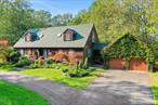 Just in time for spring! This expansive four-bedroom, two-bath Cape offers the perfect blend of privacy, comfort and convenience. Tucked away on a serene, 2.3-acre wooded lot on a private and barely travelled road, the home is surrounded by lush gardens, creating a peaceful retreat just minutes from the Ashokan Reservoir and some of the area&rsquo;s most sought-after destinations, including Westwind Orchard and Inness. Beautifully landscaped grounds feature a circular driveway in front, a fully fenced backyard with screened gazebo, and mature trees, planted beds and sprinkler systems throughout. Inside, the home features a gracious semi-open floor plan with a seamless flow between the living, family and dining rooms, all of which connect to an oversized kitchen opening to a large backyard deck. The first floor also includes a bedroom and full bath, offering flexibility for guests. Upstairs, three additional bedrooms are accompanied by a marble-tiled bathroom with a skylight, bringing in an abundance of natural light. There&rsquo;s also a full basement with tall ceilings. Upgrades include a 22kw Generac whole-house generator with 1, 000-gallon propane tank for uninterrupted power, a 3-year-old roof, 2-zoned heating, and a 3-year-old high-efficiency IBC boiler. The heating thermostats and sprinklers are equipped to be controlled remotely. A breezeway from the kitchen leads to a two-car garage, which includes a spacious storage loft potentially suitable for conversion to a finished studio. Sited on a private road with only three other homes, this property offers the rare combination of tranquility and convenience, providing easy access to the best of the Hudson Valley while maintaining a true sense of retreat