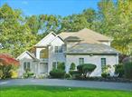 This exquisite Colonial home, custom-built by one of Rockland&rsquo;s top builders, showcases superior craftsmanship and enduring charm. Nestled on a beautifully landscaped lot with a circular driveway, the home welcomes you through a grand two-story foyer, bathed in natural light from the expansive Pella windows that grace the entire home. The main level features newly refinished hardwood floors, recessed lighting, and an expansive Primary suite complete with a large walk-in closet. The master bath offers a separate soaking tub and a spacious shower for ultimate relaxation. Freshly painted throughout, the home includes a generous living room with a wood-burning fireplace and four-panel glass doors that open to a picturesque patio and backyard oasis. Ideal for entertaining, the formal dining room flows seamlessly into the eat-in kitchen, which boasts new stone countertops, stainless steel appliances, and updated plumbing fixtures. The powder room has been enhanced with new fixtures for added convenience. Upstairs, youâ€™ll find a second Primary bedroom with an ensuite bath, newly installed pristine hardwood floors, and beautifully renovated bathrooms featuring modern vanities and fixtures. The upper level also includes a family room, three additional bedrooms, and two full baths. A charming deck with stairs to the side yard adds an inviting touch to the space. The partially finished walk-out basement is incredibly spacious, offering ample potential, with large windows, plumbing for a future bathroom, cedar closets, and a dedicated laundry room. The two-car garage has been upgraded with electric vehicle charging capabilities. Built with quality in mind, this home features engineered wood beams, copper piping, five zones of heating, and a two-zone air conditioning system, ensuring long-lasting comfort and efficiency.