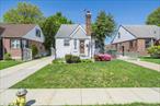 This rear dormered cape located in the tranquil neighborhood of Cambria Heights offers many great features for a new buyer to call their next home. You first enter the home to a small foyer with a coat closet leading to an open concept Dining room, living room and updated kitchen. There is also a hall that leads to a full bathroom and 1st floor bedroom. 2nd Floor has a landing area that leads to a full updated bathroom and 2 large bedrooms. Off the kitchen is an outside side door that leads to a partially finished basement. Half the basement is finished with a recreational/family room and kitchen. There is also a laundry room and an updated hot water system. Situated on a 40 x 100 lot you have great yard space with an updated 1 car garage and a private driveway. You can also access the backyard through the living room