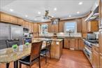 Location! Location! Location! Conveniently situated in the desirable Highlands, this 5Br/5Bth side Colonial with enormous attached 2-car garage on 0.21 acres is walk to park, places of worship, public tennis courts, public transit, schools, restaurants, shops, Doggy Day Care, & is close to golf courses, parkways & all White Plains has to offer. Priced to sell, this sprawling sun drenched 3250sf home with main levelâ€™s incredible flowing open floor plan boasting 9â€™ ceilings & direct easy access out to patio equipped with gas and hot/cold water lines for easy dining Alfresco plus level backyard affords one endless enjoyment possibilities - an idyllic paradise perfect for entertaining and relaxing in style & comfort. Starts with welcoming entry foyer graciously leading to expansive dining room built to host large dinner parties & holiday gatherings; it in turn opens to substantial living/family room distinguished by a gas fireplace flanked on both sides by sliding doors out to backyard; flowing seamlessly from living/family room is unbeatable large eat-in-cookâ€™s kitchen featuring abundant wood cabinets, ample stone countertops & â€œthe pi&#232;ce de resistanceâ€ center island with attached table for informal dining; stainless steel appliances include gigantic enviable SubZero refrigerator, 5 burner gas cooktop, 2 ovens, warming drawer, 2 dishwashers, microwave & 2 sinks. Completing the main level are a bathroom & 2 additional rooms: one a possible office/den/library & other a bedroom with deep large closet ideal family room/playroom or guest room. Second level features primary bedroom with his/her walk-in closets & ensuite spay bathroom showcasing separate soaking tub & shower, double vanity & dressing table area plus private WC plus 3 additional bedrooms - each with double closets, a Jack & Jill bathroom, hall bathroom & convenient laundry room housing LG washer & dryer. Offering great potential for customization & additional living, walk out basement has semi-finished room with full bathroom & hallway to massive 2-car garage. In addition to many deep closets is a full standup attic with pull down stairs providing huge storage space; full expansive attic could potentially be finished with space in hallway to add a staircase for easy access. An Entertainerâ€™s Dream House! Brimming with enormous versatility & possibilities, this unique property is being sold as is & awaits your personal sophisticated creative vision. Given everything original to the build in 2002/3, House is price to allow for 175 -200+K updates! if this houses with its 3250sf, 5Br/5Bth, attached 2-car garage, finished walkout basement and large patio full width of house were totally updated it would have a market value of 1.350 -1.5 million depending on level of upgrades. Prime location. 35 minutes to Manhattan, close to all including major parkways. Elementary School choice through a Lottery process so won&rsquo;t necessarily be Mamaroneck Ave Elementary School.