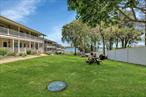Welcome to your own waterfront oasis in this charming co op community! Step outside your front porch and take in the stunning views of the bay, or head down to the bayside pool and deck for a relaxing afternoon in the sun. With your own boat slip in the marina, you can easily set sail for a day on the water whenever you please. This beautiful first floor unit is perfect for those seeking a tranquil waterfront lifestyle. Enjoy picnics at the benches throughout the community, shoot some hoops on the basketball court, or take advantage of the endless water activities such as kayaking, paddle boarding, and swimming in the bay. With the option to rent out your unit, you can easily turn this into a profitable investment opportunity. Don&rsquo;t miss out on the chance to own a piece of paradise and start living your dream waterfront lifestyle today!, Additional information: Appearance:mint, Interior Features:Lr/Dr