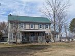 Unique Property with Tremendous Income Potential!!!Located in a beautiful, serene setting with stunning mountain views, this property offers a range of opportunities. Zoned for residential/agricultural use, the 5-bedroom, 2-bathroom home spans 2, 500 square feet and dates back to the 1890s as a Foxrun Center Hall Colonial. The home includes two additional finished rooms on the third floor (no heating), a mudroom, pantry, and a spacious living room with an office area. It sits on a 5.3-acre corner lot with tree-lined roads and ample frontage.In addition to the main house, there is a 3-car detached garage with extra space and a circular driveway. The property also boasts three large cinderblock barns, offering significant income-generating potential. These barns currently house 21 stalls, tack rooms, and hay storage. One of the barns is heated and could easily be converted into dog kennels for boarding, while the larger buildings offer plenty of space for farming equipment.The buildings include:Building #1: 4, 000 sq. ft. with large garage door openingsBuilding #2: 2, 288 sq. ft. heated barn with 5 stalls and a partially completed 2-bedroom accessory apartmentBuilding #3: 3, 504 sq. ft. barn with 16 stalls, split over two levels with a concrete second floor ideal for hay storage, covered with leased solar panelsThis property offers endless possibilities for the right visionâ€”whether youâ€™re looking to farm, start a business, or simply enjoy a large, versatile property.