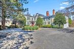 SANDS POINT PRIME LOCATION Colonial Estate with water and Manhattan views from private yard. Elegant entry foyer, expansive rooms with high ceilings throughout, formal living room with WFPLC, elegant receiving room with outdoor access, family room with built-in custom bar, WBFPLC walls of windows, outdoor access to pool. Entertain in the bright formal dining room with its own entry foyer right off the eat-in-kitchen. A massive primary en suite wing with custom closets and WBFPLC. A bonus third floor private bedroom. Full lower level with outdoor access. 2.95 Total Acres.