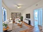 Welcome to this beautifully renovated one-bedroom apartment on the top floor of a coveted elevator building in the heart of Jackson Heights. Offering peace, quiet, and stunning views of tree-lined streets, this home is filled with natural light that highlights its recently refinished floors. The thoughtfully updated eat-in kitchen features sleek countertops, ample cabinetry, and a cozy breakfast nookâ€”perfect for enjoying your morning coffee. Recently installed, energy-efficient AC units (just one-year-old) and ceiling fans provide comfort year-round. This apartment is also investor-friendly, with the unique advantage of the ability to sublet after only one year making it an exceptional opportunity for generating rental income (A fee of 10% of the monthly rent will be paid directly to the building if subletting.) Sorry, no pets allowed.The building combines pre-war charm with modern convenience, offering wheelchair accessibility, a live-in super for excellent maintenance, and laundry facilities conveniently located in the basement. Optional storage spaces are available for a small fee, adding even more functionality to this well-maintained building, which warmly welcomes pets.Located just one block from the 82nd Street station (7 train) and close to the Roosevelt Avenue transit hub (E, F, M, R, and 7 trains), this apartment is perfectly positioned for effortless commuting. The surrounding neighborhood is brimming with amenities, including a natural food market offering organic products and Over The Moon coffee shop, known for its Colombian-inspired French pastries and family-friendly atmosphere. Liberty Bagels is just two blocks away, while a seasonal farmers market provides fresh produce, bread, fish, and flowers. Outdoor enthusiasts will enjoy Travers Park complete with tennis courts and a dog run as well as Paseo Park, Jackson Heightsâ€™ own 26-block linear park.Jackson Heights is a vibrant cultural and culinary hub, offering a dining scene that spans cuisines from Thai and French to Nepalese, Japanese, Italian, and more. The areaâ€™s unique shops, such as a stand-alone cheese store and Table Wine, are perfect for impromptu gatherings. Popular neighborhood spots like Baht, Arepa Lady, The Queensboroâ€”a coworking space by dayâ€”and Espresso 77, which transforms into a live music venue by night, add to the dynamic appeal of this community.Jackson Heights provides all the flavor and charm of Brooklyn but at a fraction of the cost, with larger, more beautiful apartments and a welcoming community. Whether youâ€™re looking for your dream home or a smart investment, this apartment delivers. Donâ€™t waitâ€¦ this apartment wonâ€™t last longâ€¦.schedule your visit today and see why Jackson Heights is one of New York Cityâ€™s best-kept secrets!