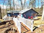 Year round 2 bedroom, 1 full bath home in the hip hamlet of Smallwood is now on the market. Easy one level living has open floor plan, wood and laminate floors, gorgeous knotty pine ceilings, walls, trim and bathroom. Very peaceful vibe and a well cared for home. Newer refrigerator, gas stove top, washing machine and 3 heating/cooling split units. New hot water heater 4/18/2025, blown-in insulation under house, new shed, 2019 septic tank and dry well. Massive deck built in 2021 perfect for grilling and chilling with family and friends. Grassy knolls on both sides of house for kids, pets and yard games. Currently being used as a full time residence. Tucked away on a road less traveled, yet part of the Smallwood community that has so much to offer. No HOA but you have the option to join the Civic Association for lake membership that includes the Smallwood Civic Park, clubhouse and plenty of scheduled events. Sandy beach for swimming, non-motor boating and fishing. Play pickleball, tennis, basketball, soccer, baseball and enjoy the new children&rsquo;s playground. Become a member of The Club at Smallwood for heated pool, club house and daily/nightly activities. Take the pup to the dog park and visit the Reserve at Smallwood for use of outdoor exercise equipment and hiking trails. Relax by the waterfall and breathe in the fresh country air. If you want more to do visit nearby Bethel Woods for concerts and festivals, waterfront dining, antique shops, breweries and farmers markets. There is plenty to explore in Sullivan County with an abundance of mountains, lakes and rivers. Call to take the tour and get ready for the 2025 season!