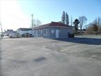 The commercial property for sale includes an 704 sq ft building that is being leased at $1, 200/month triple net on a 0.11 parcel, tax map # 111.-12-14 and an additional commercial lot that runs along the right side of the building and goes back behind the building. That parcel is tax map # 111.-12-15 and is 0.54 of an acre. Both parcels have Municipal water and sewer in the heart of the Village of Monticello. There is a 100 feet of road frontage on Broadway and 295 feet of road frontage on Park Ave. The cleared lot is suitable for building Fast Food, Retail, Office Building, etc. Survey is available