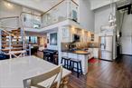 Walk in and take in soaring 14+â€™ ceilings and windows! A great duplex corner 2Br/1.5Bth home in 10 Bay St Landing! Beautifully appointed, the modern details in the kitchen and bath make this loft move ready. An imported German spiral staircase invites easy trips up to the bedrooms. The W/D room is also storage and can be an office. 1A is cocooned by trees on flr 1 and offers water views on flr 2. This is a must see. This Goldilocks home is generous yet efficient. The first floor is about 890 sq ft and the upper level adds about another -400 sq ft.1A includes an assigned parking spot right outside your windows. Heat, hot water, gas and RE taxes are included in the maintenance. Located in the gated Bay Street Landing community, also included are amenities: package collection, 24hr security, tennis/pickle ball courts, BBQ&rsquo;s, great lawns, basketball, EV chargers and dog runs. Midtown and downtown ferries are 1/2 hour ride after an 8 minute waterfront walk. No subways necessary. If you&rsquo;re seeking quality of life, it&rsquo;s one of the best kept secrets in NYC, Call for a viewing today!