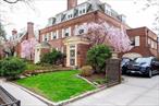 Welcome to Jackson Heightsâ€™ Historic Districtâ€™s Private Houses. This English Garden Homes located on 86 and 87 Street with a private rear garden. One of the most beautiful streets in Jackson Heights. Enter through the vestibule, immediately you feel the charm of this spacious house. Once up the 3 steps into the living room you experience the spacious rooms. The living room has a wood burning fireplace with a beautiful open stair. As you look further, you experience the formal dining room (FDR) with a framed door to the patio and rear garden. The kitchen is tucked away from the FDR with beautiful white Carrera marble counters accented by the wood cabinets and pantry. The kitchen has a door to the Patio. As you stroll through the FDR there is a powder room tucked behind the kitchen. A staircase behind the kitchen, leads to the heated garage at ground level. As you descend there is a stair to the basement. The basement houses 4 rooms, Cold storage, full bath/laundry room, playroom and boiler/utility room. There are windows in the basement for ventilation. The next level up from the living room, you will experience the southern facing Sunroom on the Mezzanine level. The stairwell is sun lit with sweet, styled windows while you climb up the staircase to the bedrooms. As you depart the sunroom, you head up to the 2nd floor landing where there is an original built in storage unit. On the 2nd floor there are 2, 1-bedroom suites. Each bedroom has a private bathroom.  The master bath is equipped with a bidet, sink and soaking tub. There is a walk-in dressing room/closet is in the master bedroom.  Proceeding up to the 3rd floor, you experience beautiful sunlight streaming through the petite windows on the walls of the staircase. The 3rd floor house 3 bedrooms. The charm of the home continues with dormer casement windows in these bedrooms. The casement windows are designed to catch the air during the spring and summer. This floor has an extra-large shared bathroom. The windowed bathroom has a tub, high ceilings, a large vanity and toilet. The house has been appointed with all new windows, updated doors, restored plaster walls new bathrooms, plumbing and central air-conditioning and a security camera system that can be accessed from every floor of the house.  Call today to move into your dream home located in the heart of Jackson Heights Historic District.