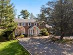 Welcome to this stately columned brick and shingle Colonial, nestled amidst lush landscaping that perfectly complements its timeless architectural elegance within the esteemed Village of Old Brookville. This home offers a harmonious blend of luxurious amenities, gracious living spaces, and thoughtful design elements, making it a true sanctuary for its next homeowner.&#160;As you approach the residence, the expansive circular stone driveway leads you to a grand double-door entry, where you are greeted by an open, spacious foyer adorned with a beautiful winding staircase. High-end interior elements include light-stained Oak hardwood floors, upholstered walls, plantation shutter doors, exquisite wall moldings and more.The main level of the home boasts large entertaining rooms, including a formal dining room, a sizable living room, an elegant powder room, a light-filled den with a brick fireplace, and a charming wet bar. The oversized French-country-inspired kitchen is a chef&rsquo;s dream, outfitted with commercial-grade appliances, coffered ceilings, and custom cabinetry.Ascending to the second level, you will find one full double-vanity bathroom and four spacious bedrooms, including the Primary Suite, which features soaring beamed ceilings and a private sitting area for ultimate relaxation. The en-suite primary bath is nothing short of a spa experience, featuring separate vanities, a deep jetted tub, and a large walk-in shower - the perfect sanctuary for unwinding after a long day. The walk-in closet is expansive, complemented by built-in shelving and a dedicated desk space for added convenience.There is a second, back stairway that leads to an unfinished attic space, offering potential for future expansion or ample storage. Additional details include a finished basement/playroom, a first-floor guest bedroom with a full bathroom, a laundry room with shelving, and an attached two-car garage.Step outside to a breathtaking outdoor paradise, where an in-ground pool and spa await, framed by a meticulously designed brick patio. Lush, mature landscaping makes this 2+ acre property extremely calming and private. There is also a spacious slate patio and grilling area, the perfect spot to host outdoors. A Har-Tru tennis court, along with a charming tennis chalet and deck, provides unparalleled opportunities for recreation and leisure. Located within the sought-after North Shore Central School District.
