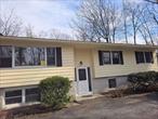 This beautifully completely renovated raised ranch offers a rare opportunity to embrace a contemporary lifestyle while preserving its classic charm. Set on a peaceful one-acre lot on a quiet dead-end road in the picturesque town of Saugerties, this home combines comfort and tranquility. With 2, 230 square feet of thoughtfully designed living space, the home boasts three generously sized bedrooms, including a private primary suite, and two-and-a-half elegantly updated bathrooms.The open and inviting layout features a spacious living room, a formal dining room perfect for entertaining, and a bright and airy eat-in kitchen. The cozy family room, complete with a charming fireplace, is the perfect place to unwind. On the lower level, you&rsquo;ll find a convenient two-car garage.