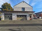 This versatile two-story masonry and wood-frame building, formerly the Stony Point Ambulance Corps, is in excellent condition and ready for various uses. The first floor features a spacious garage with drive-in truck bays and overhead doors, ideal for contractors, service businesses, or storage. The second floor offers an open area suited for offices, conference rooms, or workspaces, complete with a kitchenette and bathrooms. The fully paved lot accommodates nine cars, making it convenient for clients and staff. Currently zoned for office use, other uses would require a zoning variance. This property combines functionality and flexibility with ample parking and thoughtful designâ€”perfect for your business or investment needs.