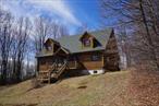 Looking for the right log home in the Catskills? This spacious chalet sits above both the very desired Livingston Manor and Youngsville. An open floor plan with a large, dining room and living room area with the center piece the large stone fireplace. Step out through either of the large glass doors leading to a large rear deck to enjoy nature. The kitchen consists of beautiful hickory cabinets topped with granite countertops, allowing you to prep meals while entertaining. Two bedrooms located in the back of the main floor. Walk up to a loft for additional sleeping quarter or office space, over looking the great room and behind that is the primary bedroom, with its own bathroom. The basement is finished for a rec-room and laundry area, off of a large two car garage. Meyer Road is a very quiet secondary road off of Shandelee Road. Five +- minutes from Livingston Manor, 20 minutes from Bethel Woods, two hours from GWB.