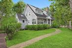 Nestled on the coveted fringe of East Hampton Village, this timeless cedar-shake Hamptons home offers refined year-round living with modern comforts. Bathed in natural light, the residence provides a serene escape from city life while maintaining effortless proximity to the region&rsquo;s finest amenities. Thoughtfully designed for both relaxation and entertaining, the home features a beautifully renovated chef&rsquo;s kitchen, a gracious living room, a formal dining room, and a sun-drenched sunroom. Offering four spacious bedrooms-including a versatile den that can serve as a fourth bedroom-and three full bathrooms, the layout is both functional and elegant. The meticulously landscaped grounds create a private oasis, complete with a heated pool, expansive decks, an outdoor shower, and a charming bar area. A stunning stacked-stone garden wall enhances the picturesque setting. Additional amenities include a garage, french doors, a stone fireplace, a security system, central vacuum, a wine refrigerator, and an irrigation system. Ideally located just moments from the vibrant villages of East Hampton and Sag Harbor, as well as pristine ocean beaches, this exceptional residence embodies the quintessential Hamptons lifestyle-seamlessly blending sophistication, comfort, and coastal charm.