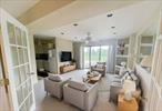 Looking for the perfect weekend escape or summer retreat? Check out this chic, fully updated two-bedroom co-op in Hampton Bays! Wake up to breathtaking bay-front views and dive into all the fun with amenities like basketball, tennis, Pickleball, and a sparkling poolâ€”all included in the HOA. Step inside your private oasis and enjoy the luxury of LVP flooring, central AC and heat, and a spacious living room designed for laid-back entertaining. The bedrooms are cozy and inviting, perfect for winding down after a day of beachside adventures. Outside, the brand-new patio and deck are perfect for al fresco dining or simply soaking in those Hamptons vibes. Plus, with your own dedicated parking spot, convenience is key. Whether you&rsquo;re looking for a seasonal getaway or a year-round home, this co-op offers effortless, stylish living in the heart of the Hamptons. Schedule a viewing today and start living your best coastal life!