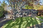 Welcome to this charming 4 bedroom, 4 bath home, nestled on a picturesque .35-acre lot with winter water views and private access to two tranquil beaches. (TAX GRIEVANCE IN PROCESS) Perfectly blending charm, functionality, and endless potential, this coastal gem offers a thoughtfully designed layout tailored for both relaxation and entertaining. The heart of the home features an inviting eat-in kitchen, a cozy den, and a spacious living room filled with natural light. Adding to its versatility, the first floor includes a unique studio and home office space. Seamlessly connected yet distinct from the main house, this thoughtfully designed two-level addition, built in 2003, features a wet bar and full bathroom. Perfect for remote work, hosting guests, creative pursuits, or even transforming into a private suite, it beautifully complements the home&rsquo;s charm and functionality. Upstairs, the primary bedroom serves as a serene retreat, complete with an en suite bathroom and a generous sitting area. The adjoining large closet offers the option to create a custom walk-in closet tailored to your needs. Additional conveniences include a 1-car garage, wired for a generator and a dedicated laundry area, enhancing everyday living. Outside, the beautifully landscaped .35-acre lot provides privacy and unparalleled access to two private beaches. Located just 6 miles from the vibrant Northport Village, you&rsquo;ll enjoy proximity to the John Engeman Theatre, charming restaurants, a scenic dock, The Northport Hotel, and a seasonal farmers market. With New York City only 56 miles away, this home offers the perfect balance of tranquility and accessibility. Don&rsquo;t miss this rare opportunity to own a property that truly has it all. Schedule your showing today and start imagining your future in this exceptional home!!