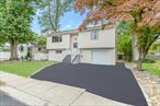 Beautifully Renovated 3 Bed / 2 Full Bath Hi Ranch. Featuring hardwood floors throughout, a large bright and airy living room, spacious updated eat in kitchen with brand new stainless steel appliances, large family room/den area with an additional full bath, large bedrooms, attic for extra storage, 1 car garage, & more! Close To Highways, LIRR, Shopping, Parks, And Most Amenities!!