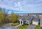 : Indulge in the luxury of this magnificent home with unparalleled, panoramic views of the majestic Hudson River. This hilltop gem, nestled on a tranquil cul-de-sac in the quaint hamlet of Port Ewen, offers an idyllic retreat with picturesque scenery all four seasons. Step inside to discover the reimagined open floor plan designed to maximize space and enhance natural lighting. The kitchen, a culinary enthusiast&rsquo;s dream, features top of the line appliances, gleaming quartz countertops, and custom cabinetry. The kitchen and living room flow seamlessly creating an inviting atmosphere for dining, entertaining and getting cozy by the gas fireplace. The first floor bedroom has original hardwood floors and a mesmerizing view that challenges you to get out of bed. The other bedroom/den also has original hardwood and sliding glass doors that open onto the main floor deck where you can bask in the all encompassing scenery and savor the serenity as nature surrounds you. Ascend to the second floor, where the primary suite awaits. This luxurious sanctuary encompasses the entire level, featuring a spa-like bathroom, walk-in closet, and a private deck to enjoy sweeping 180 degree Hudson River views of the Kingston-Rhinecliff Bridge and Rondout Lighthouse. The lower level offers a versatile space that can be transformed into a media room, home office, family room or private suite. Complete with a full bath, large laundry room, spacious cedar closet, utility room, and additional storage, this unique space is perfect for the extended family or occasional guest. This move-in ready home has been thoughtfully reimagined to expand the living space while preserving the cozy ambiance that makes it so special. The prime location offers a convenient commute to Poughkeepsie and Rhinecliff train stations, as well as easy access to the NYS Thruway, Kingston, Woodstock, New Paltz, Rhinebeck, and minutes to the Historic Rondout Waterfront. With so much at your fingertips, this home truly embodies the ideal blend of comfort, convenience, and breathtaking natural beauty.