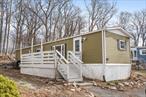 Welcome to your new home â€”a cozy 2-bedroom, 1-bathroom manufactured home offering 720 square feet of comfortable living space. This residence features a well-equipped kitchen, spacious living areas and more. Outside relax on the large deck! The home provides a warm and inviting atmosphere, perfect for those seeking a manageable and efficient living environment. Situated in a convenient location, this property offers easy access to local amenities and services.