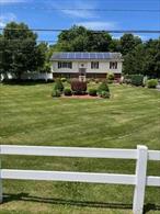 Move-in ready raised ranch in Hopewell Junction.... Town of East Fishkill.Close to all transportation, shopping and schools.Extras include: built-in pantry, hardwood floors, silestone tops, coffered ceilings, Murphy bed in guest bedroom, crown molding, professional looking hand-made bar in entertainment room, double-filtered water softener, 1000 gal water tank, double-tiered deck around 18x 36 above-ground pool, heated garage, solar panels, and back-up generator w/seamless operation.