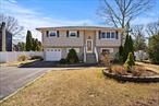 Welcome to this spacious 4-bedroom, 1.5-bathroom, high ranch nestled in the desirable Manor Park neighborhood and sought-after Eastport-South Manor School District. Situated on a .25-acre lot, this home offers both comfort and convenience, just 4 minutes in either direction to Sunrise Highway or the Long Island Expressway for easy commuting. Inside, the second floor features a large kitchen with a dining area, a bright and inviting living room, and three well-sized bedrooms. The first floor offers a versatile living space with outdoor access, an additional bedroom, bathroom and laundry room. Step outside to enjoy the above-ground vinyl pool, perfect for summer relaxation and plenty yard space for entertaining. This home is a fantastic opportunity in a prime location. No Certificate of Occupancy for garage conversion, first floor kitchen or converted bathroom. Currently verifying deck permits with town. Property being sold as is.