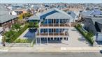 Rare New Construction Opportunity in East Atlantic Beach â€“ FEMA Compliant & minutes from the Ocean! Discover the potential of this exceptional new construction home, situated on three separate lots in the exclusive private beach community of East Atlantic Beach. Just one block from pristine sandy shores, this west-facing property offers breathtaking sunsets and afternoon sun, making it the perfect coastal retreat. Built with quality craftsmanship, this home is currently framed with a new roof, 80% of plumbing completed, and 200-amp electrical service installed. Featuring Andersen 400 Series windows throughout, central AC systems, and framing for a possible elevator spanning from the ground floor to the third level. Enjoy two expansive ocean view Trex decks equipped with under-deck drainage systems. PROJECTED LAYOUT:Ground Floor: 9-ft ceilings, prepped for radiant heat, 2-car garage, additional storage, and access to the side yardâ€”ideal for an outdoor shower. The north side yard offers space for a pool, while the south side features an 18-ft wide driveway accommodating 4+ cars. Main Level: A massive open layout designed for your dream kitchen, dining area, and living space, with a setup for a gas fireplace. A walk-in pantry and laundry room add convenience, while a half bath enhances functionality. The expanded deck allows for steps leading to the north side yard, creating indoor-outdoor access. Upper Level: A luxurious primary suite featuring soaring cathedral ceilings, space for a spa-like en-suite bath, a sitting area, a walk-in closet, and a private ocean view deck. Features two additional well-appointed bedrooms and a full bathroom.This is your chance to customize a dream beach home in highly sought-after East Atlantic Beach. With construction well underway, bring your vision and finishing touches to make this your perfect coastal escape! Located just one block from the private beach and moments from Long Beachâ€™s iconic boardwalk, local dining, and boutique shops, this home offers the best of coastal living.