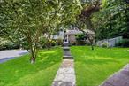 Nestled on a picturesque 1.4 acre lot in a serene wooded Croton Village neighborhood, this beautifully maintained split-level home offers 3 bedrooms, 2.1 bathrooms, and a spacious layout perfect for comfortable everyday living. Step down into the inviting living room, featuring a large picture window filling the room with natural sunlight and a two-sided fireplace. The formal dining room is perfect for hosting or every day dining with a door to a private patio and fenced backyard. The custom gourmet kitchen boasts elegant leathered granite countertops and custom cabinetry. Up a few steps, the primary suite includes a private bath, while two additional bedrooms share a full bathroom. The lower level offers a large family room with a home gym, a door to the patio, a half bath, laundry, and a large versatile office/den with built in cabinets & shelves. A sub-basement provides incredible storage and utilities. Enjoy year-round comfort with hardwood flooring on the main and bedroom levels,  central air, and a generator hookup. The expansive 1.5-acre property offers privacy, a storage shed, and a relaxing hot tub in the backyardâ€”perfect for unwinding in a peaceful natural setting. Mature landscaping surrounds this home. Sprinkler system in front yard. Unwind after a long day in the hot tub set in the backyard. The oversized driveway and carport provide plenty of parking. Take advantage of Croton Village amenities, including Silver Lake Beach, Senasqua Park on the Hudson River, and resident parking at the Croton-Harmon Train Station for an easy commute. Enjoy a short walk to village restaurants, shops, and parks. Donâ€™t miss this rare opportunity to own a peaceful retreat in the Village of Croton!