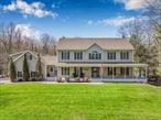 Come and fall in love with this beautiful 4-Bedroom Colonial featuring an income-generating apartment in Saugerties! Nestled in a sought-after area of Saugerties, this stunning 4-bedroom, 2.5-bath colonial home is situated on over an acre of lush, wooded grounds. Inside, you&rsquo;ll discover exquisite design features, including exposed wood beams, an authentic brick kitchen wall, and custom cabinets that combine sophistication with ample storage. The open floor plan boasts nine-foot ceilings, creating an airy and inviting atmosphere. The kitchen seamlessly connects to a cozy living area with a gas fireplace, while French doors open up to a spacious deck and patioâ€”ideal for hosting gatherings in the picturesque backyard, complete with a dazzling pool and hot tub. Upstairs, you&rsquo;ll find four generously sized bedrooms and two full bathrooms, ensuring both comfort and privacy, along with a convenient laundry room. Plus, there&rsquo;s a charming half bath on the main level, perfect for guests! Above the three-car garage, there&rsquo;s a separate one-bedroom, one-bathroom apartment that has a strong track record of consistent Airbnb bookings, complete with its own private patio. Additional highlights include a stylish mudroom for keeping things organized, an unfinished basement with endless potential, and a lovely covered front porch. This home is just minutes from the vibrant communities of Saugerties and Woodstock, with easy access to outdoor activities like skiing, kayaking, and hiking. This property is a tranquil retreat waiting to welcome youâ€”don&rsquo;t miss the chance to make it your own!