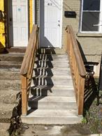 AS IS - SELLER MOTIVATED Located in the Historic District, next to Mount Saint Mary College Campus. This end brick row house is attached on one side. Two separate porches to enter each floor thru apartment. Completely renovated, newly painted, new floors, new lighting and SS appliances. Open floor dining shared with living room. Backyard for use.Separate utilities, all new.Convenient location to college, restaurants, public library, hospital and shopping amenities. Close driving distance to Interstate Highways 84 and 87, Stewart Airport or Metro North in Beacon.