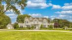 An inviting and impressive white stone drive welcomes you to this Magnificent, Nantucket Style Beach Cottage in the heart of the Village of Westhampton Beach. This exquisite home has been updated and expanded to perfection with a brand new roof (2024). The home boasts an old world charm coupled with all modern amenities. The gracious entry foyer leads you to grand principle rooms. On one side of the foyer your guests will enjoy a large spacious sun drenched living room leading to a unique brick covered patio. On the opposite side of the foyer is the banquet sized dining room with room for multiple guests to enjoy meals prepared in the gourmet EIK. The kitchen is the host to high end appliances, bespoke cabinetry, butler&rsquo;s wet bar and a unique massive copper island, making entertaining a breeze. The kitchen overlooks an expansive yet inviting, great room, which includes a separate dining area, wood burning fireplace, and access to the patio, with built-in BBQ, gunite pool, hot tub, covered porch, and meticulously landscaped yard. The first floor also offers a warm, private and cozy office/den with gas FP. A grand staircase brings you to the second floor featuring a luxurious, sun filled primary suite fitted with a spa-like bath, lounge area and tremendous closet space. Two additional oversized bedrooms, two updated marble baths and laundry complete the second floor. The third floor offers three more nice sized bedrooms, a sitting area and oversized updated bath. Plenty of rooms and space for all of your friends and family.