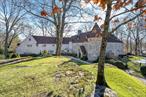 Magnificent French chateau built by famed architect Frank Forster is a timeless masterpiece set on a private 1.88-acres with 5 bedrooms, 4.3 bathrooms, 4 fireplaces, and an attached 4-car garage. Built in 1931, the homeâ€™s original charm has been expertly maintained w/ old-world elegance in every room. The living room is a gorgeous space to host, with a wood beam ceiling, a window seat, and a fireplace. Juxtapose is the cozy office/library w/ custom built-ins. Feast in luxury in the spacious dining room w/ another well-appointed limestone fireplace and French doors to the bluestone patio. The expansive eat-in kitchen features stainless steel appliances, ample cabinetry, and a breakfast area. Take the winding staircase to the second level that offers privacy for you and your guests, including a massive primary suite. The backyard is a landscapers paradise perfectly manicured and maintained with a wraparound bluestone patio and an in-ground pool surrounded by mature trees for enhanced privacy.