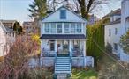 Choose your Hudson view from your front porch or second floor enclosed balcony in this superb village stunner. This 3 bedroom home has preserved its vintage charm, thanks to the owner&rsquo;s care, with an attractive and artistic color scheme, hardwood floors, sconce lights, and artisan early 20th century millwork. The kitchen has a breakfast bar, and a pass through to the formal dining room, featuring a decorative rose ceiling medallion to dine in style.. You&rsquo;ll find lots of useful bonus space in the walk up attic, great for an office, den, play area, or just storage with- yes- an even more dramatic view of the village and Hudson. Even before you walk in you&rsquo;ll adore the spacious rocking chair porch, and once inside you&rsquo;ll get used to all that natural light in the living room right away. The main bedroom is so spacious it runs the length of the house, and the two other bedrooms both have doors leading to the second floor enclosed terrace/balcony where the Hudson river views hit you between the eyes. The gently sloped rear yard has ample room for recreation, outdoor relaxation, and lots of opportunity to garden with the existing landscaping. The full basement has a walkout to storage beneath the front porch. There is off street parking for two in the driveway, and the location is convenient to many village offerings, with shops, schools, downtown and local fare all within a few blocks. Truly a dreamy lifestyle at this price point!