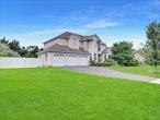 3200+ sq ft, soaring ceilings, open floor plan, generous room sizes. Elegant entry, 19 foyer w Grand staircase that leads to landing. Main level & room sized landing features hardwoods floors. Lots of windows and natural light. Main level Eat in Kitchen/Formal LR/Formal DR/ Den with Fireplace/Butler Pantry/Bedroom/ Half Bath. This Upstairs theres a Double door Wonderful Primary Bedroom w Tray Ceiling, Nice En Suite Bath & WIC, 3 addl bedrooms upstairs. Full 9 Basement w Outside entrance, 200AMP, 3 car garage. Landscaped, Patio, In Ground Sprinklers. Alarm System. 2 Separate heating & Air conditioning units.
