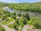 Riverfront!!! Here&rsquo;s the riverfront place of your dreams! Hard to find property, located in the charming hamlet of Barryville. This fabulous vintage home is ready to be totally rehabilitated & brought back to it&rsquo;s original 1910 charm! Additional lot w/ 322&rsquo; of Delaware River Frontage included that offers this place so much potential. Fabulous location w/ frontage on two roads, Route 97 & River Road! Spectacular Views of the river & the Barryville-Shohola Bridge. Walk to conveniences, farmers market & to your own Delaware River frontage for recreation & total relaxation! Home needs complete restoration from roof to basement but retains it&rsquo;s original charm & character w/wood floors, original kitchen cabinets & wainscoting. A great opportunity for a true old house lover that&rsquo;s not afraid to roll up their sleeves & hire a contractor to totally rehabilitate this great old home. Being sold in it&rsquo;s current condition; this property has so many uses so let your imagination soar!!!