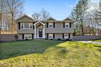 Nestled in a peaceful cul-de-sac in Airmont, NY, this beautifully maintained bi-level home is a true gem! With 5 spacious bedrooms, 2 full baths, and a stunning custom kitchen featuring quartz countertops and Kraftmaid cabinets, this home has it all. The great room extension with vaulted ceilings, added in 2018, provides the perfect space for entertaining. Step outside and enjoy the breathtaking views of the private backyard oasis, perfectly blending serene woods and lush greenery. The expansive yard offers ample space for outdoor living, entertaining, and creating unforgettable memories with family and friends. Recent upgrades include full insulation and a new hot water tank in 2024