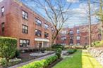 BEST LOCATION NEAR TOWN & LIRR - TOP FLOOR! Large Entry Foyer/Office with Large Walk-in Closet and Additional Coat Closet - Large Sunny Living Room/DR - Renovated Eat-in Kitchen with Breakfast Bar, Wainscoting, Stainless Steel Appliances & Window - Washer/Dryer in Kitchen - Hardwood Floors - Crown Moldings - 3 Window Units - Storage Included in Low Maintenance - Newly Renovated Lobby - Parking Around the Circle for Unit Owners w/Sticker - Permit Parking in Parking Garage Located 2 Blocks Away Only $40 per Month. - Within Close Proximity to Shopping, Parks, & A Few Blocks from Buses & LIRR (24 min express to NYC. Penn & Grand Central Station) - Residents Enjoy Great Neck Park District Amenities Including Parkwood Pool with Olympic Pools, Lazy River, Tennis, Sport Courts & Ice Skating - Summer Concerts Tuesday nights in Grace Ave - Steppingstone Waterfront Park. CATS ALLOWED!