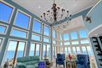 Sunrise to Sunset, this waterfront stunner brings the vibes-and the views! Rooftop Deck, wall to wall windows, luxe en-suites, and docking for all your toys.Set on its own private peninsula with nearly one acre of land directly on the Great South Bay, this gated 4935sqft estate offers new navy bulkhead & a protected boat slip for docking up to a 37&rsquo; boat. An exceptional property for boaters, fishing enthusiasts and anyone seeking a waterfront retreat!Inside, soaring walls of windows in the living room, family room and dining room frame breathtaking panoramic water views. A Sleek bar in the living/dining area adds a touch of refined indulgence for entertaining. The spacious chef&rsquo;s kitchen features a large center island with prep sink, Thermador appliances, including two full refrigerator freezers, a built in coffee bar, and sleek custom finishes.The home offers two primary suites and three additional guest rooms, each with private en suite bathrooms, ensuring comfort and privacy for all.Outdoor living is unparalleled, with expansive bayfront entertaining spaces and gravel hardscaping, a rooftop terrace, and multiple lounge areas overlooking the water. Perfect for enjoying sunrises, sunsets, and even fireworks!