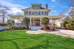 Welcome to a stunning piece of history nestled in the heart of Stony Brook - a magnificent 1904 Craftsman home that seamlessly blends period charm with modern luxury. This 6-bedroom, 5-bath residence sits proudly on 0.92 acres of meticulously landscaped grounds, offering 4091 square feet of thoughtfully designed living space.Inside, discover the impeccable craftsmanship of a bygone era, showcased through original natural woodwork, stunning chandeliers, solid quarter-sewn oak doors, exquisite Brazilian cherry, white oak and maple inlay floors, wall panels, picture rails, original grand staircase, charming pocket doors, and beautiful window frames - all quarter sewn oak. Soaring 10&rsquo; ceilings adorned with crown molding and multiple inviting fireplaces create warm, intimate spaces throughout. The eat-in kitchen features granite counters, a center island, and modern stainless steel appliances while maintaining the home&rsquo;s historic character.Venture outside onto the magnificent wrap-around porch â€“ the perfect setting for hosting memorable summer gatherings where you and your guests can enjoy the distant melodies of summer concerts from Stony Brook University floating through the warm evening air. Fall weekends bring the special charm of hearing the spirited Seawolves marching band and the excitement of home football games, creating a uniquely collegiate atmosphere without leaving your home. Imagine cool drinks in hand as conversation flows and laughter mingles with these iconic university sounds carried on the breeze.The property boasts a remarkable detached carriage house - a versatile space with many options. Outdoor living is equally impressive with a private, heated in-ground pool with a natural rock waterfall feature, personal pickleball court, and enchanting gardens thoughtfully designed to showcase colorful blooms every season (maintained by a 17-zone sprinkler system!). Mature trees provide both beauty and privacy, creating a serene sanctuary.Located in desirable Stony Brook, this exceptional property offers convenient proximity to Stony Brook University, hospitals, shopping, and local attractions. The Three Village School District and easy access to transportation add to this home&rsquo;s incredible appeal.This rare offering combines historic architectural details, modern amenities, and income-generating potential in one of Long Island&rsquo;s most sought-after communities. Don&rsquo;t miss this opportunity to own a piece of Stony Brook history.