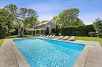 Located south of the highway, this stunning postmodern offers you everything you could want and more for your Hamptons vacation. As soon as you enter this home, you are welcomed with luxury modern living at its finest. The bright white open first floor greets you with a spacious living room with a wood-burning fireplace, private office, eat-in kitchen with vaulted ceilings and dining area, half bath and a first floor en-suite. The second level flaunts a master suite with fireplace, walk-in closet and master bath with soaker tub, step-in shower and double sinks. An additional en-suite bedroom and two guest bedrooms complete the second level. The lower levels offers access to laundry, full bath and additional space for your needs. The backyard provides ultimate privacy and enchanted-like atmosphere, making it your favorite spot at this home. Enjoy summer BBQs on the covered back porch or lounge poolside by the heated in-ground pool. Have kids? They will absolutely love the playground set equipped with swings, slide and rock climbing wall. Located just minutes away from the renovated Westhampton Beach Village Main Street, Dune Road beaches, and neighboring the Westhampton Golf Course. AVAILABLE FOR: August-LD ($55K)