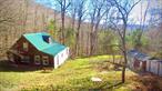 Wow! Welcome to YOUR Mountain Escape! Quaint, rustic cabin on 4.14 acres that backs up to hundreds + acres of NY State Lands! Just up the road from Big Pond/ Little Pond NYS DEC lands and close to numerous trailheads where you can hike for miles in the protected Delaware Wild forest. Fishing, hiking and hunting opportunities abound and only about one half hour drive to some of the regions best skiing make this an amazing retreat in all seasons! Besides the prime location in the sought after Beaverkill Valley area, the current owner has made drastic recent improvements on some big ticket items. Have your morning coffee on the expansive brand new deck,  enjoy the reliability of a newly drilled well and recent plumbing upgrades, relish the toasty warmth of a new wood stove, feel secure with the brand new electric service and refresh yourself with a shower in the brand new tiled bathroom! Bring your design ideas to freshen up the interior or enjoy as is! Come see it now! Fully available!