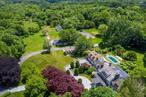 A one of a kind estate compound on 17.73 acres, incredibly offered for under 10 million dollars, and one of the largest and most exclusive properties offered in Purchase in many years. Estate includes: (i) a totally renovated and elegant 6 bedroom primary home; (ii) adorable 3 bedroom stone guest cottage; (iii) oversized pool with adjoining cabana/great room/BBQ/kitchen facilities; (iv) an enormous multi purpose separate outbuilding with horse stalls and extra garage bays; (v) stand alone horse barn; (vi) greenhouse; (vii) separate paved/possible sport court space; and (viii) multi acre level park-like extra land. This special and unique offering in lower Westchester is perfect as a convenient get away compound, horse property and/or just a spectacular year round estate with priceless extra property. Unmatched convenience to NYC, airports, water/boating, golf/country clubs, and numerous vibrant downtown areas including Rye, White Plains and Greenwich. Rolling lawns, magnificent plantings, fountains/reflecting pond, inviting front porch, private gated approach and so many special extras too numerous to list. A treasure property to be had for generations, so rarely offered in lower Westchester and incredibly priced.