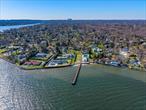 Introducing a rare and remarkable opportunity to own a piece of prime waterfront in the prestigious Village of Kings Point. This exceptional 1.23-acre property offers breathtaking views and endless potential with an expansive dock. Situated on stunning waterfront grounds, this unique parcel was once home to the Broadlawn Harbour Pool Club and now presents the perfect canvas to build your dream home with unique potential to design a long, wide private gated driveway leading to East Shore Road for added privacy and grandeur. Whether you&rsquo;re envisioning a modern masterpiece, a classic estate, or a serene retreat with resort-style amenitiesâ€”this property provides the space and setting to bring your vision to life with panoramic waterviews.