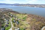 **Builders and developers - amazing opportunity to build on a river view lot in Beacon with minimal upfront land cost! Seller is open to structuring a deal that allows the property to be developed, with payment for the property upon sale of the home. *** Tucked away in one of Beaconâ€™s most sought-after spots, this rare parcel offers the perfect balance of privacy and proximity. Imagine waking up each day to year-round views of the majestic Hudson Riverâ€”whether itâ€™s bathed in golden fall light, glistening with winter frost, or reflecting the vibrant colors of spring and summer.Set back from the road, the lot provides a quiet, secluded setting while keeping you just minutes from Beaconâ€™s lively Main Street, Metro-North station, hiking trails, and waterfront parks. Itâ€™s a peaceful escape with everything you love about Beacon right at your fingertips.Public water and sewer connections are available, giving you a head start in bringing your vision to life. Whether you&rsquo;re dreaming of a custom-built home or a serene weekend retreat, this is a rare chance to own a piece of Beacon with unmatched views and unbeatable charm.This lot is more than landâ€”itâ€™s the beginning of something extraordinary.